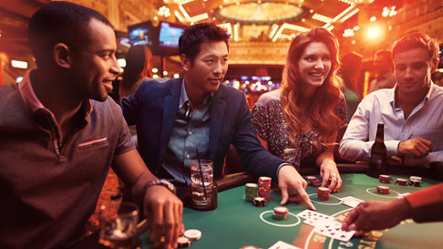 group of people playing blackjack